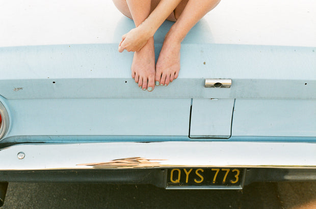 FEET ON A CAR